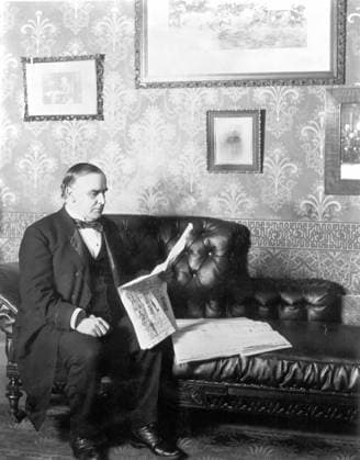 William McKinley Reads About his own Presidential Victory Seated on a couch, William McKinley reads the local Canton newspaper, which gives the news that he will be the next president. EDITORIAL USE ONLY Copyright: xx 25.115 x picturehistory006986
