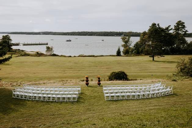 wedding ceremony location in field with flowers next to ocean Yarmouth, Maine, United States CR_SSNF240120C-1300132-01