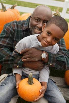 Portrait of African father and son holding pumpkin Virginia Beach, VA, 21.12.2023, model released, TTBB_BLD035869.jpg, African American, african ethnicity, agriculture, autumn, boy, caring, childhood, color image, crop, day, elementary age, farm, grandfather, grandson, halloween, holding, looking at camera, man, mature adult, outdoors, people, photography, portrait, pumpkin, side view, sitting, smiling, two people, vertical, minority, minorities2, 40-45, 40-50, 45-50, 50-55, 50-60, 55-60, adult, african, african-american, afro american, afro-american, black, care, celebration, child, children, color, colour, daylight, daytime, fall, family, farming, fellow, festival, fifties, fifty, forties, forty, fruit, gentleman, gourd, grampa, gramps, Copyright: xMarkxEdwardxAtkinsonx