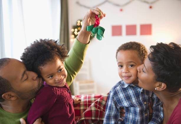 Black father holding mistletoe over daughters head Jersey City, New Jersey, USA, 21.12.2023, model released, TTBB_BLD085123.jpg, 2-3 years, 30-34 years, affection, african-american ethnicity, anticipation, arms raised, bonding, boy, boys, brother, brunette, celebration, cheek, childhood, christmas, closeness, color image, cute, daughter, day, devotion, domestic life, enjoying, family, family with two children, father, festive, four people, front view, fun, girl, girls, grinning, happy, head and shoulders, heterosexual couple, holding, holiday, horizontal, husband, indoors, kissing, lifting, love, man, mid adult, mid adult men, mid adult women, mistletoe, mother, people, photography, preschooler, pride, side view, sister, smiling, son, surp Copyright: xJGI JamiexGrillx