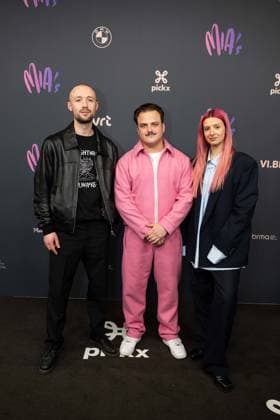 an unidentified man, rapper Glints (C - Jan Maarschalk Lemmens) and an unidentified woman pictured on the red carpet at the 16th edition of the MIA s (Music Industry Award) award show, in Antwerp, Wednesday 24 January 2024. The Music Industry Awards are the Flemish Music prizes handed out by the VRT and VI.BE.  JONASxROOSENS 84571431
