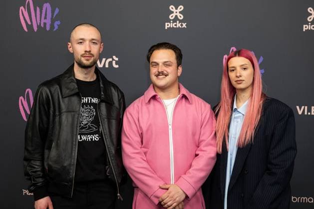 an unidentified man, rapper Glints (C - Jan Maarschalk Lemmens) and an unidentified woman pictured on the red carpet at the 16th edition of the MIA s (Music Industry Award) award show, in Antwerp, Wednesday 24 January 2024. The Music Industry Awards are the Flemish Music prizes handed out by the VRT and VI.BE.  JONASxROOSENS 84571452