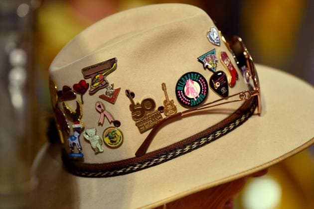 TAMWORTH COUNTRY MUSIC FESTIVAL 2024, Commemorative pins on a spectator?s hat are seen at the 2024 ABCRA National Finals Rodeo during the 52nd Tamworth Country Music Festival in Tamworth, New South Wales, Friday, January 26, 2024. The biggest music festival in the country returns, with the 52nd Golden Guitar awards to be announced. ( NO ARCHIVING, EDITORIAL USE ONLY, NO USE IN BOOKS WITHOUT CONSENT TAMWORTH NEW SOUTH WALES AUSTRALIA  Copyright: xBIANCAxDExMARCHIx 20240126001893880420