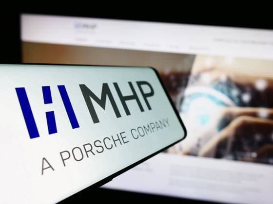 Smartphone with logo of company MHP Management- und IT-Beratung GmbH on screen in front of website. Stuttgart, Germany - 08-20-2023: Smartphone with logo of company MHP Management- und IT-Beratung GmbH on screen in front of website. Focus on center-left of phone display. Copyright: xZoonar.com TimonxSchneiderx 21005470