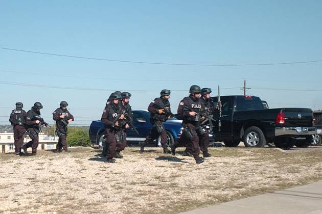 Swat Team Fort Hood, TX - November 5, 2009 -- SWAT team members approach a building with a gunman inside. Thirteen people were killed and 30 more wounded in an attack by a lone gunman at Fort Hood, Texas, Thursday, November 5, 2009..Mandatory Credit: Jason R. Krawczyk - U.S. Army via CNP Fort Hood Texas United States of America EDITORIAL USE ONLY Copyright: xx hires_swatc JasonxR.xKrawczykx cnpphotos021417