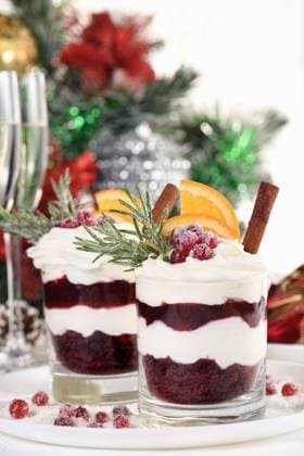 Christmas cranberry dessert tiramisu Christmas cranberry dessert tiramisu with mascarpone and whipped cream, chocolate biscuit crumble and cranberry jam, garnished with orange slices, candied cranberries and rosemary. Copyright: xZoonar.com MarynaxVoronovax 21069419