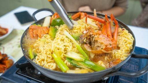A selective closeup of Korean ramen with seafood in a hot pot 2736209