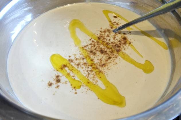 Homemade Tahini Paste food background Homemade tahini paste served in a bowel with olive oil and paprika. Tehina is a condiment made from toasted ground hulled sesame. EDITORIAL USE ONLY Copyright: xx RafaelxBen-Arix cewitness039520