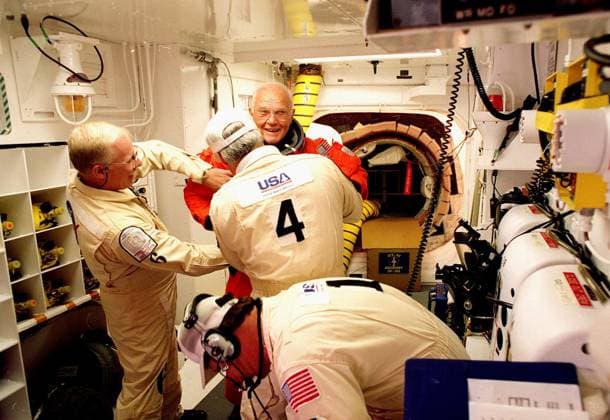Astronauts Group Photo In the launch pad s White Room, STS-95 Payload Specialist John H. Glenn Jr., U.S. Senator from Ohio, has his flight suit checked by closeout crew members before climbing into space shuttle Discovery for his second flight into space on October 29, 1989, which came 36 years after his Mercury launch. Glenn was the first American to orbit the Earth. Credit: NASA via CNP Cape Canaveral Florida United States of America EDITORIAL USE ONLY Copyright: xx 493265main_1998-10-29_full NASAx cnpphotos032532
