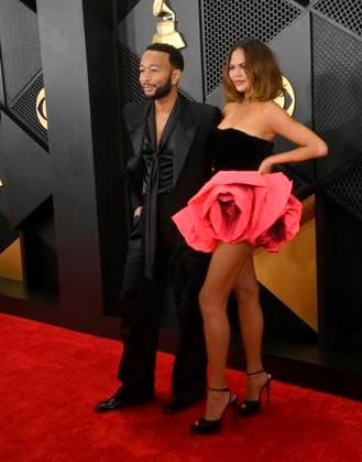 (L-R) John Legend and Chrissy Teigen attend the 66th annual Grammy Awards at the Crypto.com Arena in Los Angeles on Sunday, February 4, 2024.  LAP20240204047 JIMxRUYMEN