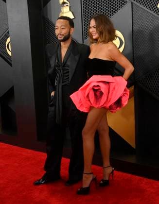 (L-R) John Legend and Chrissy Teigen attend the 66th annual Grammy Awards at the Crypto.com Arena in Los Angeles on Sunday, February 4, 2024.  LAP20240204048 JIMxRUYMEN