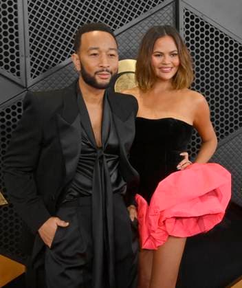 (L-R) John Legend and Chrissy Teigen attend the 66th annual Grammy Awards at the Crypto.com Arena in Los Angeles on Sunday, February 4, 2024.  LAP20240204049 JIMxRUYMEN