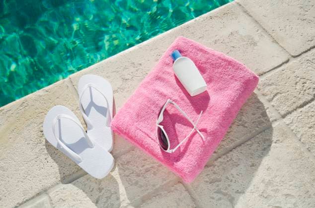 Sandals and towel at poolside , 08.12.2011, TTBB_ti0027_00662.jpg, Day, Leisure, Swimming Pool, Towel, Summer, Outdoors, Relaxation, Horizontal, Vacations, High Angle View, Sandal, Waters Edge, Lotion, Pink, No People Copyright: xChrisxHackettx