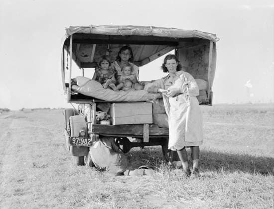 Destitute Texan family leave their home to seek work in Arkansas cotton fields, 1936 (b w photo) 1249098 Destitute Texan family leave their home to seek work in Arkansas cotton fields, 1936 (b w photo) by Lange, Dorothea (1895-1965); Private Collection; (add.info.: Family between Dallas and Austin, Texas. The people have left their home and connections in South Texas, and hope to reach the Arkansas Delta for work in the cotton fields. Penniless people. No food and three gallons of gas in the tank. The father is trying to repair a tire. Three children. Father says, It s tough but life s tough anyway you take it ). Copyright: xBridgemanxImagesx 1249098