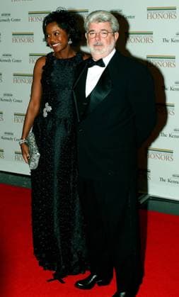 Washington, D.C. - December 2, 2006 -- Melody Hobson and .George Lucas arrive for the State Department Dinner for the 29th Kennedy Center Honors dinner at the Department of State in Washington, D.C. on Saturday evening, December 2, 2006. Andrew Lloyd Webber, Zubin Mehta, Dolly Parton, Smokey Robinson and Stephen Spielberg are being honored in 2006 for their contribution to American culture..Credit: Ron Sachs CNP EDITORIAL USE ONLY Copyright: xx x cnpphotos037745