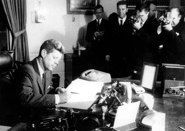 US President John Fitzgerald Kennedy Signing Declaration of Naval Blockade of Cuba, October 29, 1962 (b w photo) 1666805 US President John Fitzgerald Kennedy Signing Declaration of Naval Blockade of Cuba, October 29, 1962 (b w photo); (add.info.: President John F. Kennedy announces to the American people that he has ordered a blockade of Cuba in response to the discovery that Soviet missiles were being installed on the island. In his televised speech, he condemned Soviet leader Nikita Khrushchev for the clandestine, reckless and provocative threat to world peace? and warned that the United States was fully prepared to retaliate should the missiles be launched.). Copyright: xBridgemanxImagesx 1666805