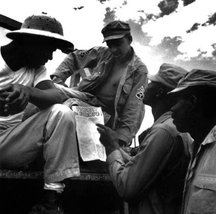 African-Americans Soldiers reading the Declaration of Victory in Europe, 9th May 1945 (b w photo) 1721275 African-Americans Soldiers reading the Declaration of Victory in Europe, 9th May 1945 (b w photo) by American Photographer, (20th century); (add.info.: American troops in Burma : African-Americans soldiers reading declaration of president Truman about Victory in Europe may 9, 1945). Copyright: xBridgemanxImagesx 1721275