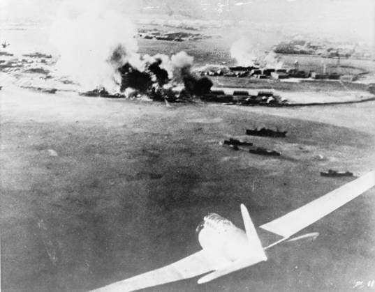 Aerial photograph by a Japanese pilot of the destruction of Pearl Harbor, 1941 (b w photo) 1766203 Aerial photograph by a Japanese pilot of the destruction of Pearl Harbor, 1941 (b w photo) by American Photographer, (20th century); Private Collection; (add.info.: Japanese bomber in lower right foreground during the attack by the Imperial Japanese Navy against the United States naval base at Pearl Harbor in Hawaii on the morning of December 7th 1941 which led to the United States entry into World War II.). Copyright: xBridgemanxImagesx 1766203