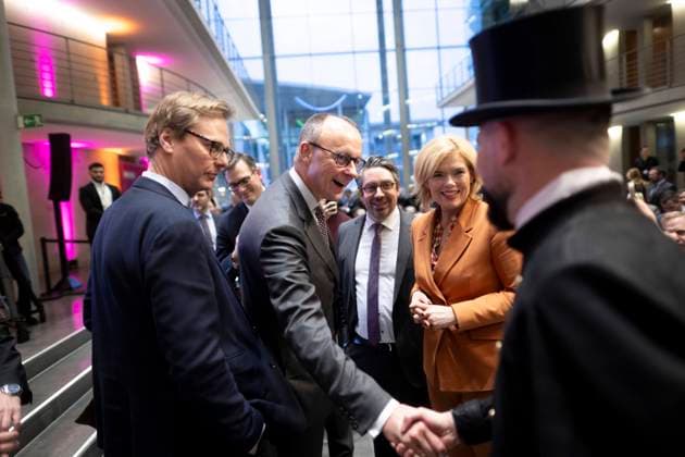 Friedrich Merz, CDU Wirtschaftswende fuer Deutschland DEU, Deutschland, Germany, Berlin, 01.02.2024 Ein Schornsteinfeger begruesst Friedrich Merz , Fraktionsvorsitzender der CDU CSU und Vorsitzender der CDU , und Julia Kloeckner , Bundesschatzmeisterin der CDU, beim Kongress Wirtschaftsgipfel der CDU CSU Fraktion zum Thema Wirtschaftswende fuer Deutschland im Foyer vom Paul-Loebe-Haus in Berlin Deutschland en: A chimney sweep welcomes Friedrich Merz, parliamentary group leader of the CDU CSU and chairman of the CDU, and Julia Kloeckner , federal treasurer of the CDU, at the congress economic summit of the CDU CSU parliamentary group on the topic of economic transition for Germany in the foyer of the Paul-Loebe-Haus in Berlin Germany ***