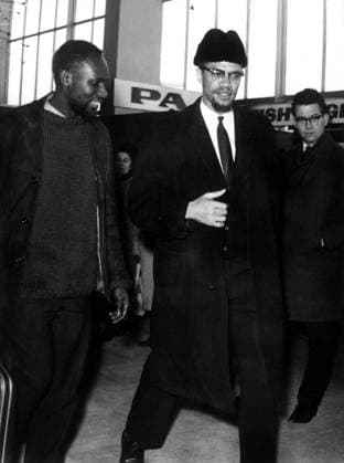 Malcolm X 1981083 Malcolm X by Unknown photographer, (20th century); (add.info.: Malcolm X (1925-1965) at London airport on february 9, 1965 (France doesn t want him on french territory)). Copyright: xBridgemanxImagesx 1981083