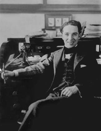 Charlie Chaplin, 1915-20 (b w photo) 3247661 Charlie Chaplin, 1915-20 (b w photo); Private Collection; (add.info.: Sir Charles Spencer Charlie Chaplin (1889-1977) was an English comic actor, filmmaker and composer who rose to fame in the era of silent film He may be signing his contract with the Mutual Film Company , an early American motion picture conglomerate best remembered as the producers of some of his greatest comedies. In 1916, Chaplin became the highest paid entertainer in the world when he signed a contract for ,000 per year. Mutual built Chaplin his own studio and allowed him total freedom to make twelve two-reel films during this fruitful twelve-month period). Copyright: xBridgemanxImagesx 3247661
