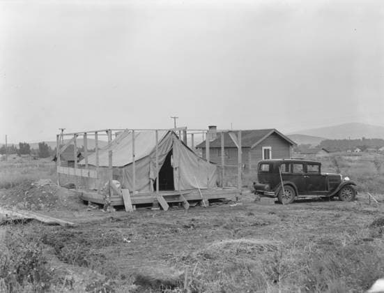 Family living in tent while building the house around them, near Klamath Falls, Oregon, 1939 (b w photo) 3710102 Family living in tent while building the house around them, near Klamath Falls, Oregon, 1939 (b w photo) by Lange, Dorothea (1895-1965); Private Collection; (add.info.: Klamath county, Oregon). Copyright: xBridgemanxImagesx 3710102