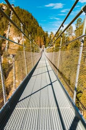 Geometric alpine summer view at the famous Highline 179 suspension bridge and the Ehrenberg castle ruins near Reutte, Tyrol, Austria highline179 AX 095