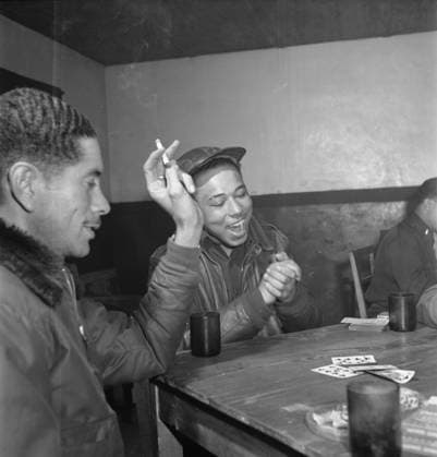 Tuskegee airmen playing cards in the officers club in the evening, 1945 (b w photo) 7214916 Tuskegee airmen playing cards in the officers club in the evening, 1945 (b w photo) by Frissell, Toni (1907-88); Private Collection. Copyright: xBridgemanxImagesx 7214916
