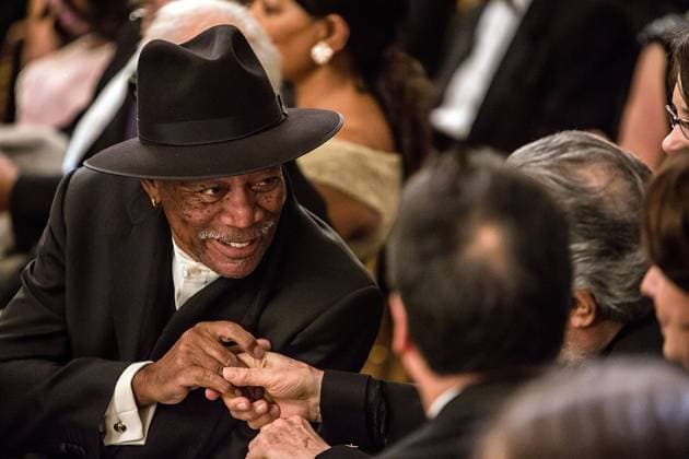 Actor Morgan Freeman greets another guest at the Kennedy Center Honors reception at the White House on December 2, 2012 in Washington, DC. The Kennedy Center Honors recognized seven individuals - Buddy Guy, Dustin Hoffman, David Letterman, Natalia Makarova, John Paul Jones, Jimmy Page, and Robert Plant - for their lifetime contributions to American culture through the performing arts. .Credit: Brendan Hoffman Pool via CNP EDITORIAL USE ONLY Copyright: xx x cnpphotos041752