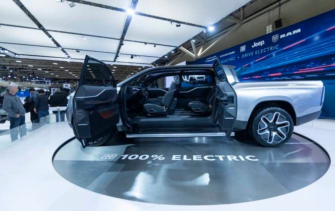 (240217) -- TORONTO, Feb. 17, 2024 -- People look at a RAM electric truck during the 2024 Canadian International AutoShow in Toronto, Canada, Feb. 16, 2024. The annual 2024 Canadian International AutoShow kicked off here on Friday to showcase the latest innovations, trends and advancements in the automotive world with the participation of 45 automotive brands. (Photo by Xinhua) CANADA-TORONTO-CANADIAN INT L AUTOSHOW ZouxZheng 