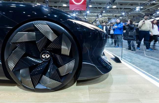 (240217) -- TORONTO, Feb. 17, 2024 -- People look at an Infiniti s Vision Qe all-electric concept car during the 2024 Canadian International AutoShow in Toronto, Canada, Feb. 16, 2024. The annual 2024 Canadian International AutoShow kicked off here on Friday to showcase the latest innovations, trends and advancements in the automotive world with the participation of 45 automotive brands. (Photo by Xinhua) CANADA-TORONTO-CANADIAN INT L AUTOSHOW ZouxZheng 