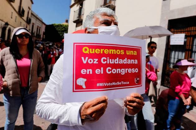 March in Defense of Democracy in Queretaro - 18 Feb 2024 A protester holds a placard during a March in Defense of Democracy. With a call to defend democracy and institutions, Querétaro joined the March for our democracy , a citizen mobilization that takes place simultaneously in several cities in the country. Queretaro Mexico Copyright: xCesarxGomezx xSOPAxImagesx _EGR2284