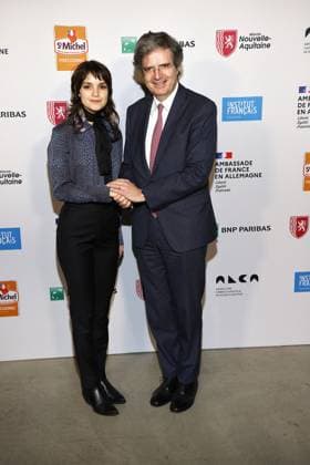Luise Befort with the French Ambassador Francois Delattre at the award ceremony of the Order of the Chevalier for Art and Literature during the Berlinale Soiree Francaise du Cinema at the French Embassy on 19 February 2024 in Berlin Berlinale Soiree Francaise 2024 Award of the Chevalier Order for Leila Hamid Martin Kochendoerfer