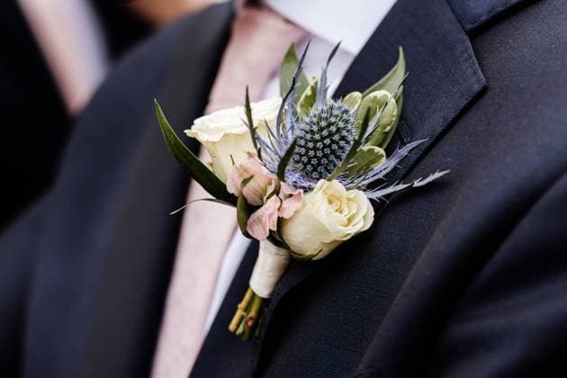 summer wedding boutonniere with blue eryngium and roses Winnipeg, Manitoba, Canada CR_MFBW240214-1352111-01