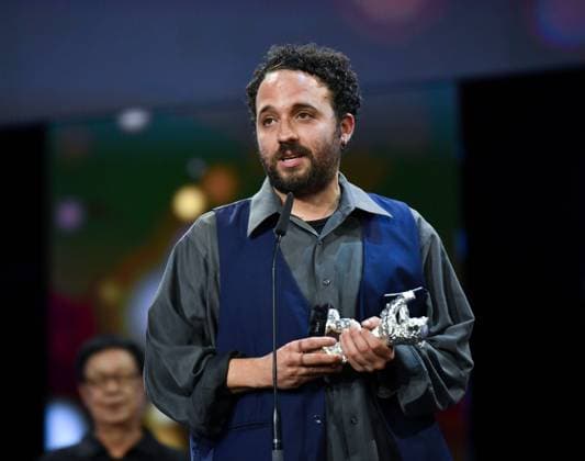 (240225) -- BERLIN, Feb. 25, 2024 -- Director Nelson Carlos De Los Santos Arias speaks after receiving the Silver Bear for Best Director during the 74th Berlin International Film Festival in Berlin, Germany, Feb. 24, 2024. ) GERMANY-BERLIN-INTERNATIONAL FILM FESTIVAL RenxPengfei 