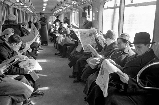 Moscow, USSR. Passengers in a carriage of the Lenin Moscow underground read newspapers with a report on the world s first space flight by Soviet citizen Yuri Gagarin, who became the Earth s first cosmonaut. The highest quality available Vladimir Lagranzh, Valentin Mastyukov TASS  67311107