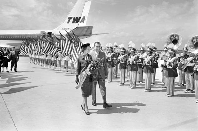 U.S. Vice President Richard M. Nixon with his wife Pat Nixon walk by band and American flags at airport during campaign trip, Indianapolis, Indiana, USA, Thomas J. O Halloran, U.S. News & World Report Magazine Photograph Collection, September 14, 1960 U.S. Vice President Richard M. Nixon with his wife Pat Nixon walk by band and American flags at airport during campaign trip, Indianapolis, Indiana, USA, Thomas J. O Halloran, U.S. News & World Report Magazine Photograph Collection, September 14, 1960. Copyright: 1010_05_ghi-circa12279
