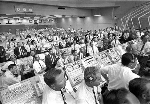 Members of government-industry team rise from their consoles in Launch Control Center to listen to U.S. Vice President Spiro Agnew s remarks following Apollo 11 liftoff, Kennedy Space Center, Merritt Island, Florida, USA, NASA, July 16, 1969 Members of government-industry team rise from their consoles in Launch Control Center to listen to U.S. Vice President Spiro Agnew s remarks following Apollo 11 liftoff, Kennedy Space Center, Merritt Island, Florida, USA, NASA, July 16, 1969. Copyright: 1010_05_ghi-circa12441