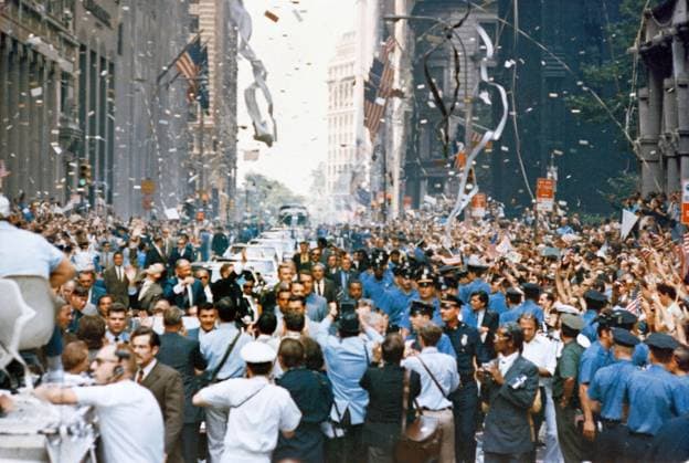 Ticker tape parade for Apollo 11 crewmen, from right in lead car are astronauts Neil A. Armstrong, commander; Michael Collins, command module pilot; and Edwin E. Aldrin Jr., lunar module pilot, Broadway, New York City, New York, USA, NASA, August 13, 1969 Ticker tape parade for Apollo 11 crewmen, from right in lead car are astronauts Neil A. Armstrong, commander; Michael Collins, command module pilot; and Edwin E. Aldrin Jr., lunar module pilot, Broadway, New York City, New York, USA, NASA, August 13, 1969. Copyright: 1010_05_ghi-circa12454