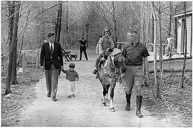 Kennedy and Kids at Camp David United States President John F. Kennedy, John F. Kennedy, Jr., Caroline Kennedy ( riding Tex ) at Camp David, near Thurmont, Maryland, March 31, 1963..Mandatory Credit: Robert Knudsen White House via CNP Thurmont Maryland United States of America EDITORIAL USE ONLY Copyright: xx RobertxKnudsenx cnpphotos065373