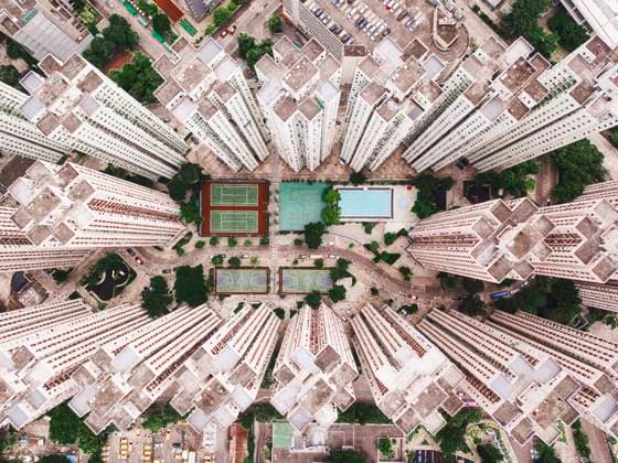 Creative Highlights World Swimming pool with sports courts near tall buildings, MMPF01201