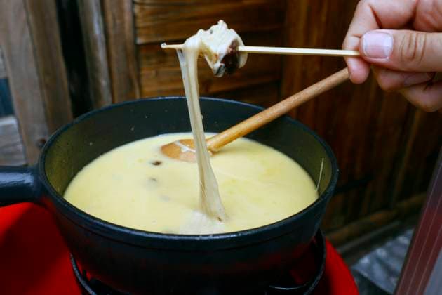 RECORD DATE NOT STATED Traditional swiss cheese fondue at table in restaurant. Saint-Gervais Mont-Blanc. France. Traditional swiss cheese fondue at table in restaurant. Saint-Gervais Mont-Blanc. France. Copyright: Godongxcontact@godong-photo.com 971_29_FR656720A