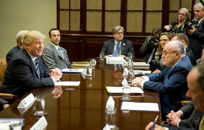 United States President Donald Trump holds a listening session with cyber security experts in the in the Roosevelt Room of the White House in Washington, DC on Tuesday, January 31, 2017. Former Mayor Rudy Giuliani (Republican of New York) is across the table at right. Credit: Ron Sachs Pool via CNP EDITORIAL USE ONLY Copyright: xx x cnpphotos067202