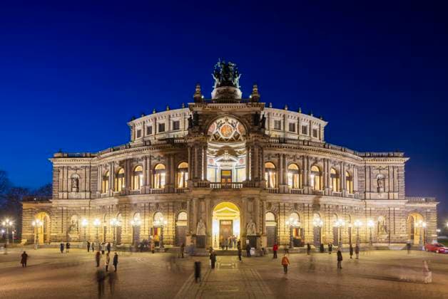 Dresden Old Town Semperoper on Theaterplatz with King John Monument in the evening Dresden Saxony Germany
