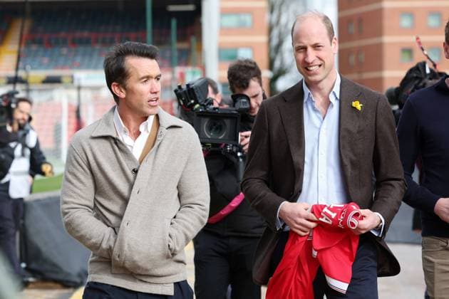 . 01 03 2024. Wrexham, United Kingdom. Prince William with a personalised Wrexham Football Club shirt along with club Chairman, the actor Rob McElhenney , during a visit to the club in Wrexham, Wales, United Kingdom, as he marks St.Davids Day.  xPoolx xi-Imagesx IIM-25027-0035