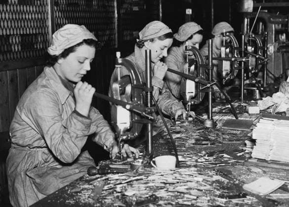 Side profile of female workers working in a factory, England  Copyright: xx 990-2203