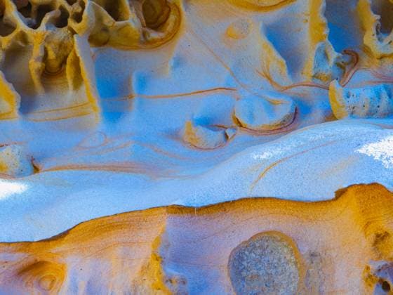 Creative Highlights World Detailed close-up of the naturally vibrant and patterned sandstone cliffs of Jaizkibel, showcasing the geological beauty and unique color combinations found on the Gipuzkoa coast. Model Released HodeiUnzueta_ID19812_587697_023 Copyright: xHodeixUnzuetax