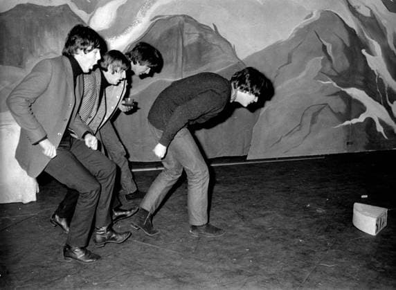 December 23, 1964: London, England, United Kingdom: The Beatles, were seen preparing for their Christmas Show at the Hammersmith Odeon venue. The show is already sold out and appearing with the Beatles will be Freddie and the Dreamers and Jimmy Saville. Shown in the photo the Beatles group comprise of JOHN LENNO, PAUL, McCARTHY, RINGO STARR, and GEORGE HARRISON as they rehearse a dance move: London United Kingdom - ZUMAk09_ 19641223_jtc_k09_501 Copyright: xKeystonexPressxAgencyx