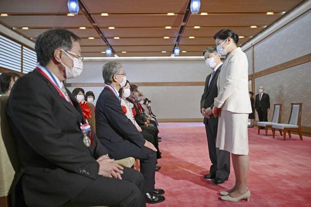 Emperor meets with awardees at Imperial Palace Japanese Emperor Naruhito (2nd from R) and Empress Masako (R) talk with people who received awards for their contribution to the fields of agriculture, fisheries and livestock raising at the Imperial Palace in Tokyo on March 15, 2024. (Pool photo)  A14AA0002600804P