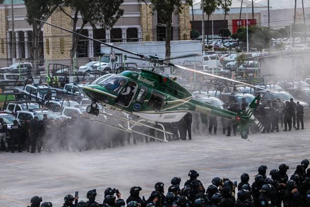 March 15, 2024, Ecatepec de Morelos, Mexico: A member of the State Police flight a helicopter during the departure of a security operation called Rastrillo to combat crime in the Municipality of Ecatepec. More than 1,300 elements from the Attorney General s Office of the Republic (FGR), the Attorney General s Office of the State of Mexico (FGJEM) and the State Police take part during the Operation. on March 15, 2024 in Ecatepec de Morelos, Mexico. Ecatepec De Morelos Mexico - ZUMAe321 20240315_zia_e321_026 Copyright: xRickxCruzx